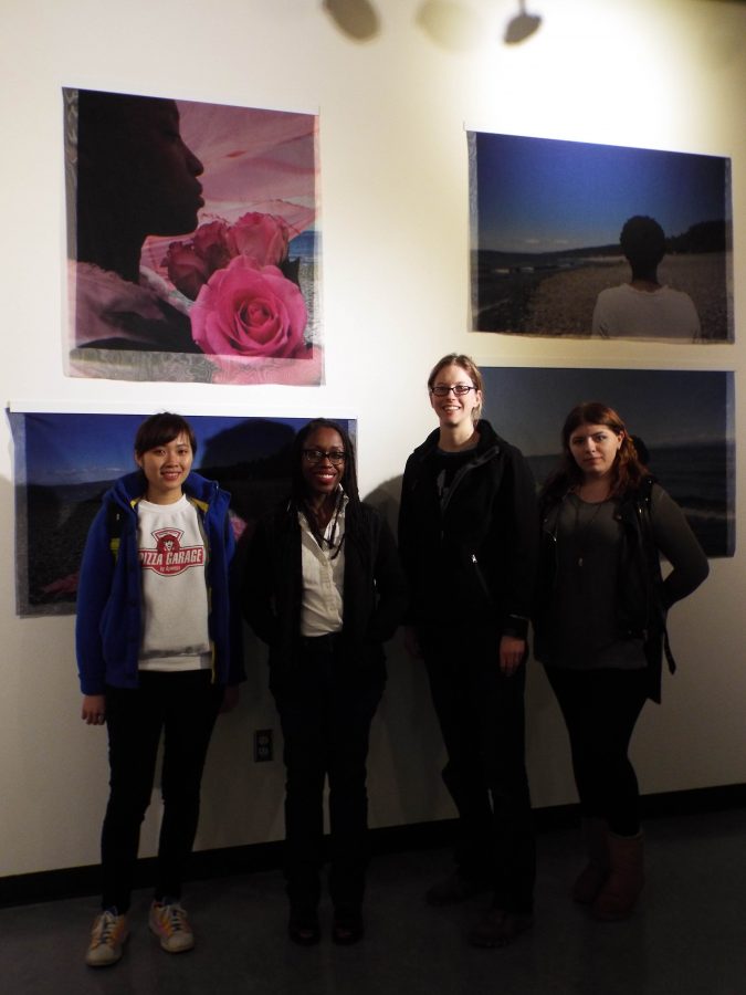 C Davida Ingram (second from left) poses with students in front of a set of four pieces printed on fabric, titled “Lexical Tutor.”
