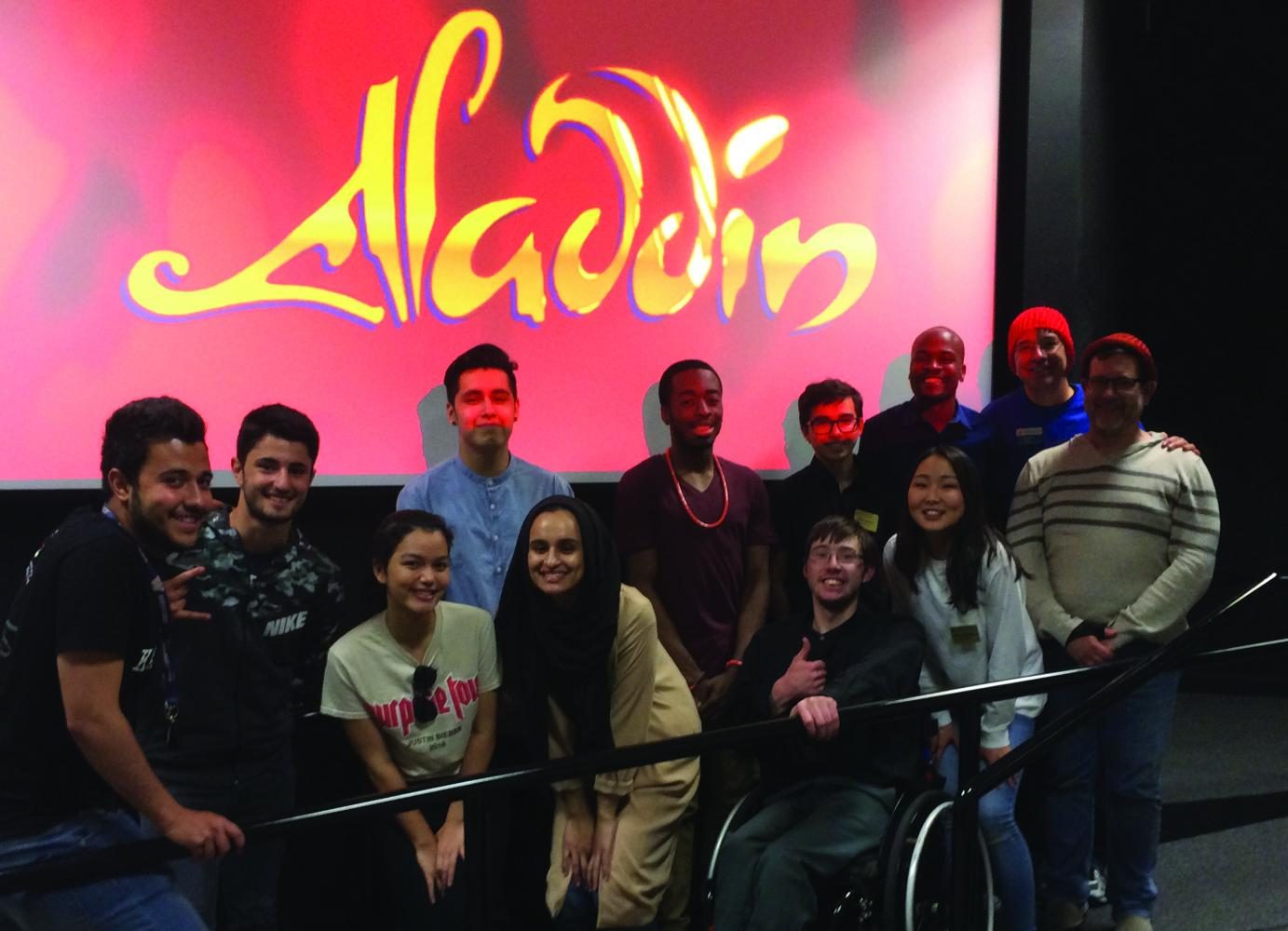 Services for Students with Disabilities Programmer Robert Barker (first row, second from right) gathers with volunteers, Student Activities Board members, and SSD staff before the May 19 movie night begins.