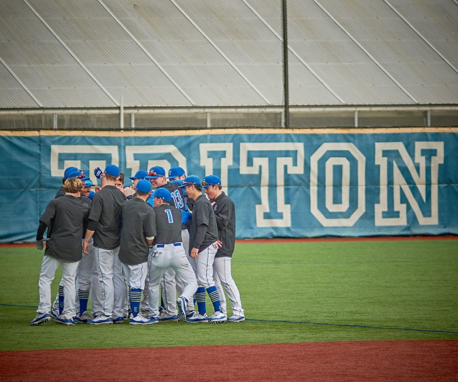 The Tritons, huddled together for a team chant before their game.