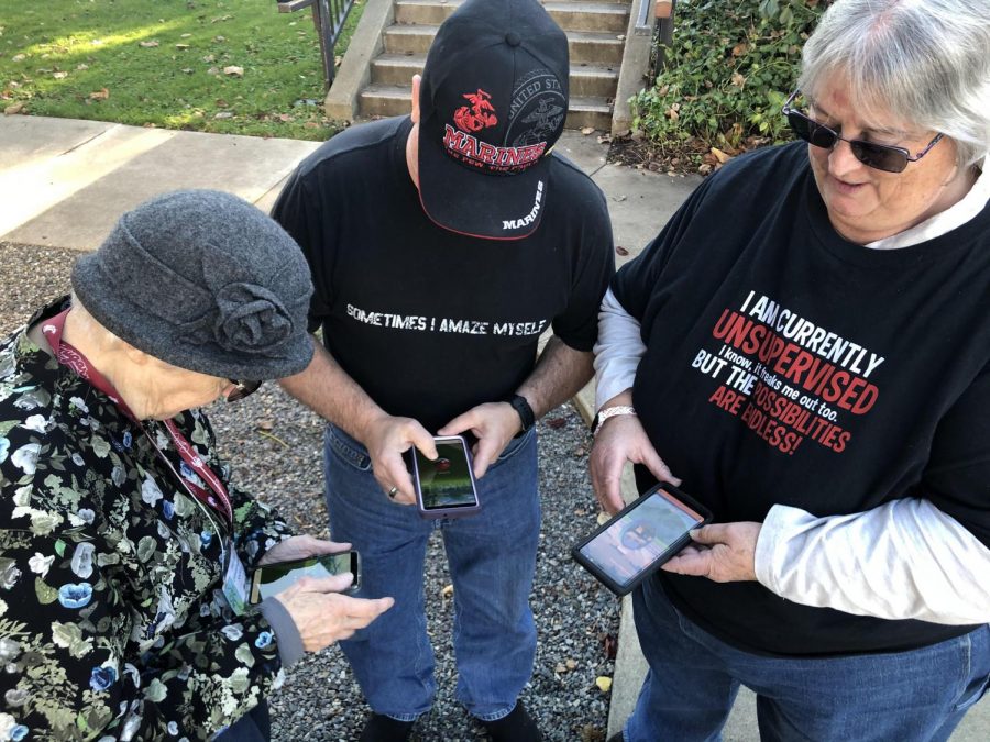 (Left to right) Marge, Michael and their friend Lynn playing Pokemon GO at Heritage Park.