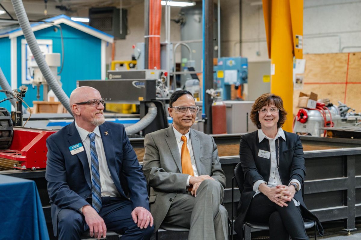 Edmonds President Amit Singh sits with XX and XX at the announcement of the colleges selection to participate in aa new three-year manufacturing pilot program.